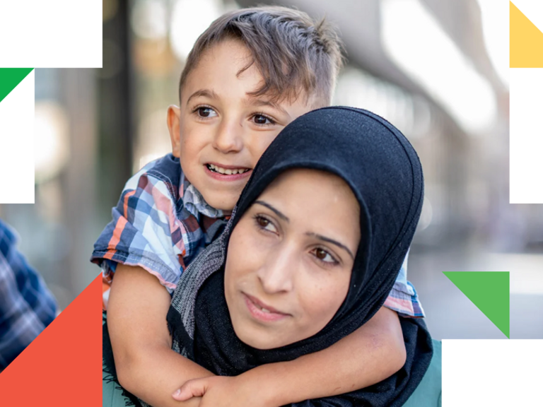 A woman holding a child in her arms.